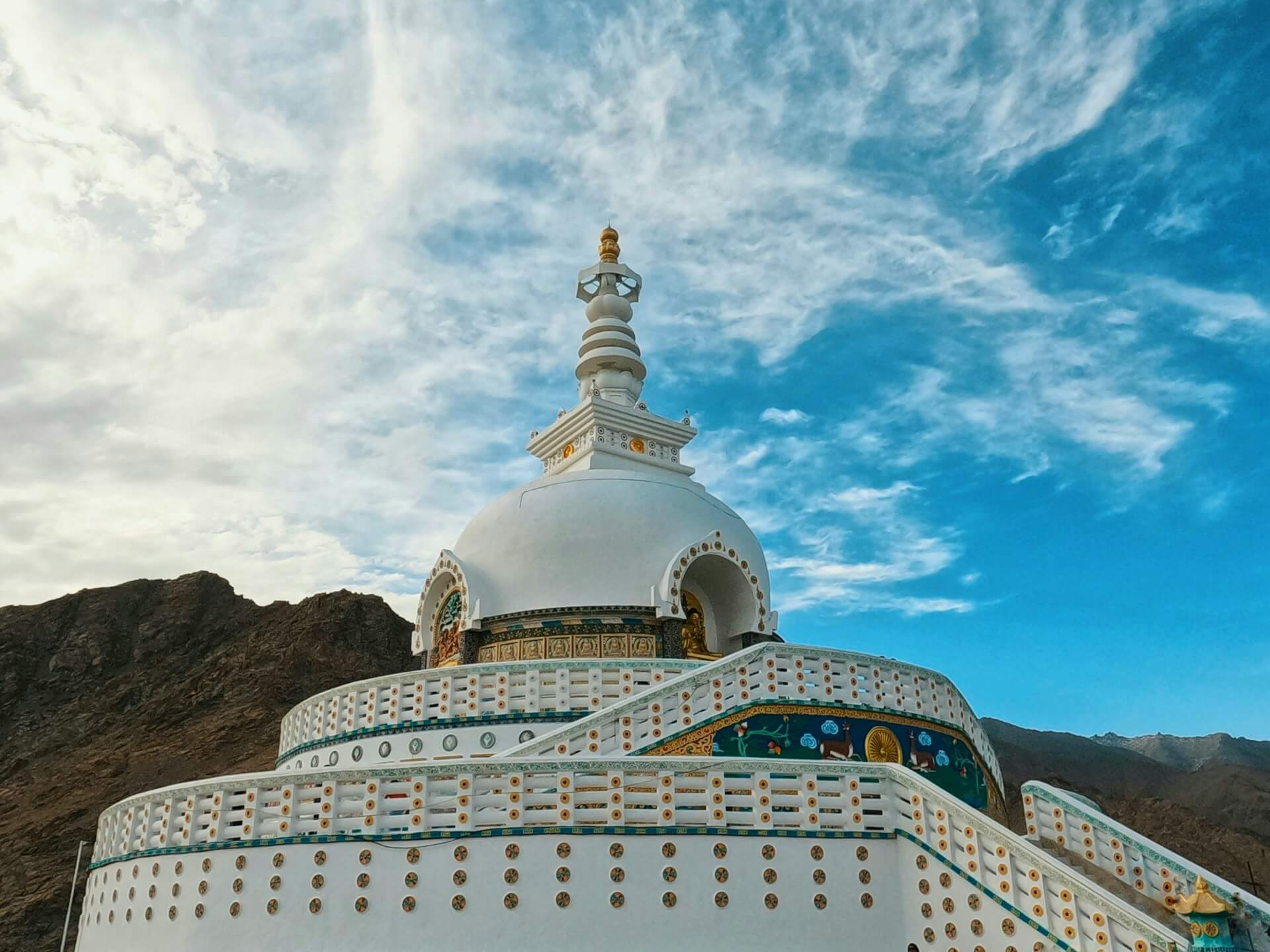 Shanti Stupa white Buddhist stupa Leh Ladakh hilltop sunset