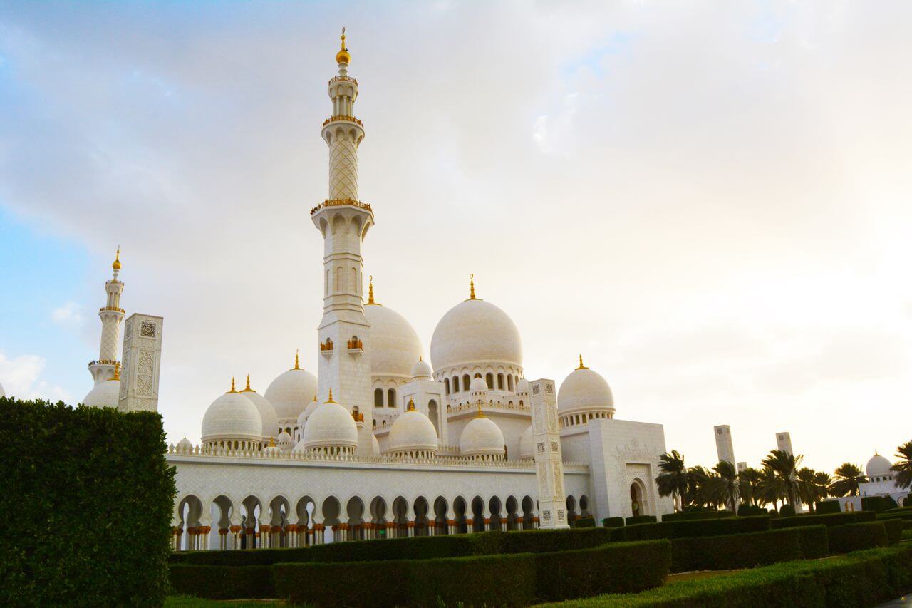 The vast marble courtyard and floral mosaics of the Sheikh Zayed Grand Mosque, Abu Dhabi