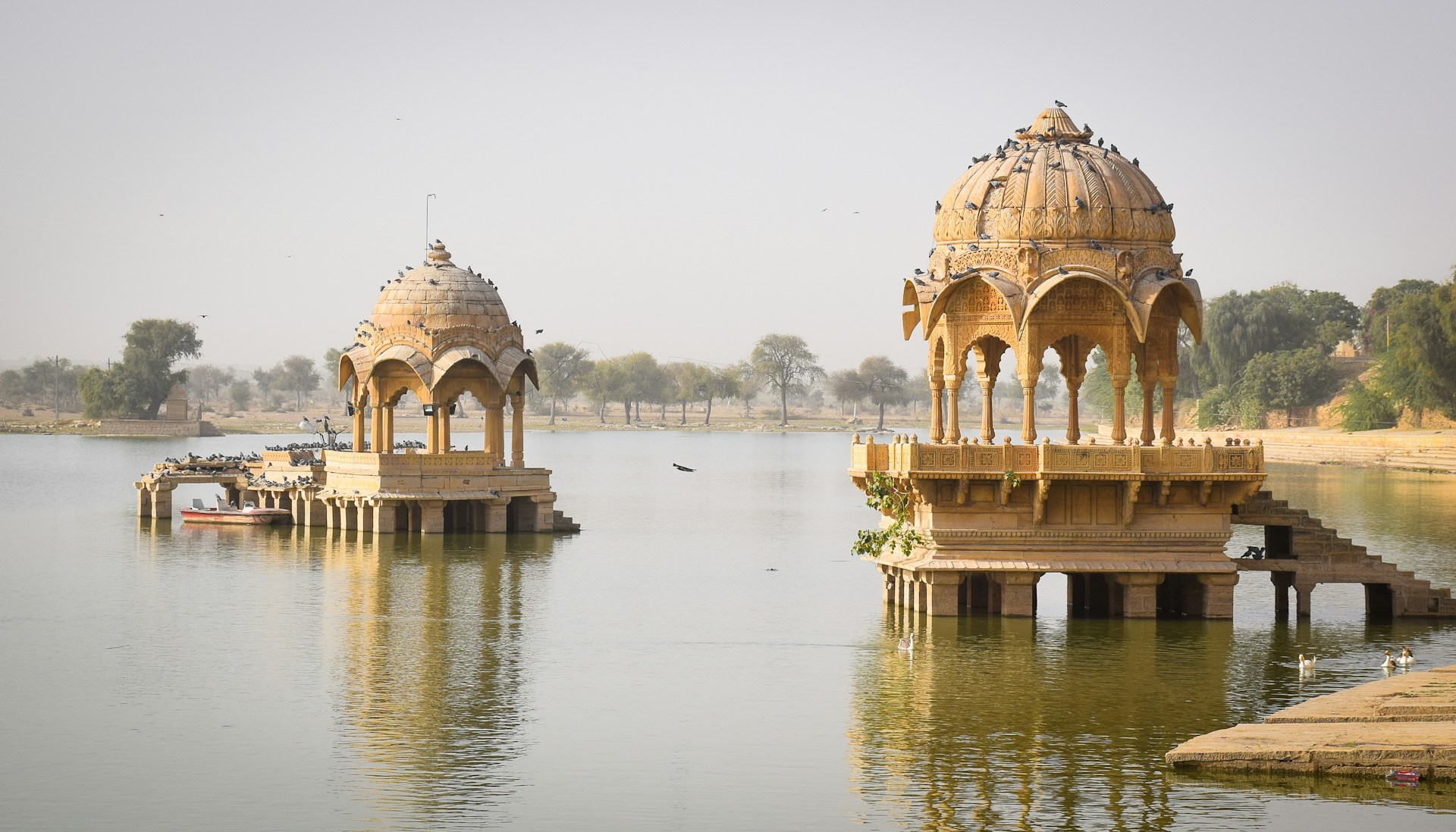 Gadsisar Lake Jaisalmer sunrise boats temples chhatris golden reflection